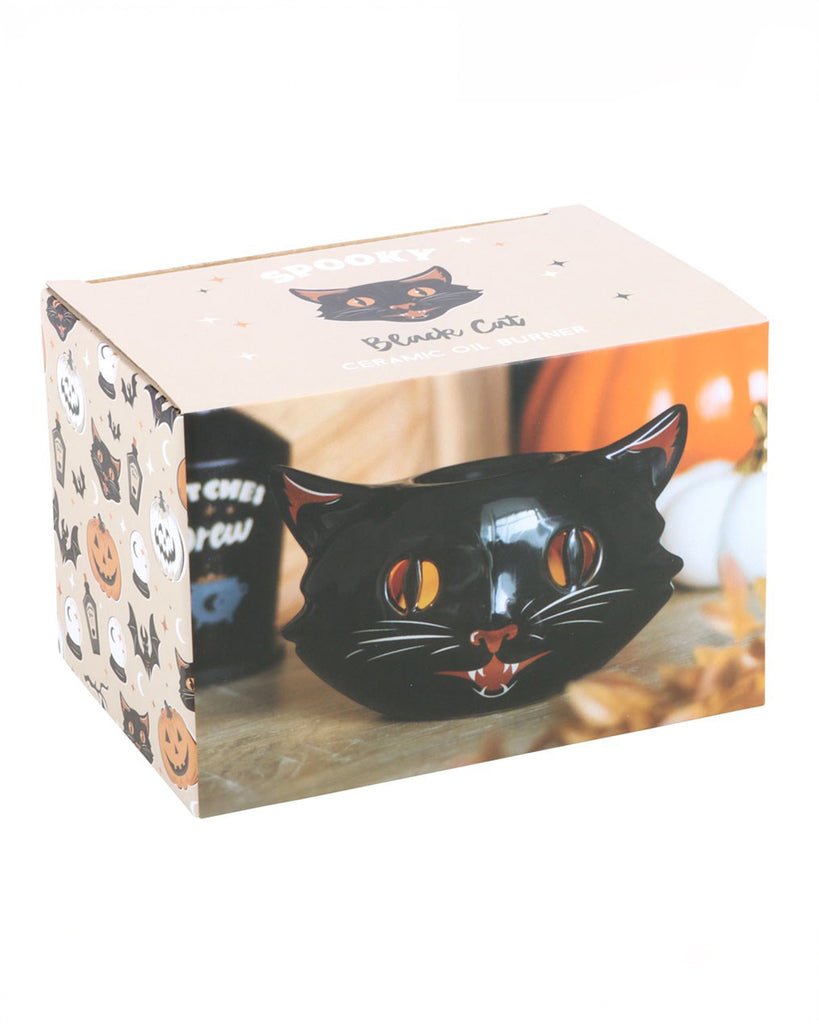 The packaging of the Spooky Black Cat Oil Burner by Rebel Romance. The box features retro-inspired Halloween illustrations with pumpkins, bats, and black cats, ideal for gifting.