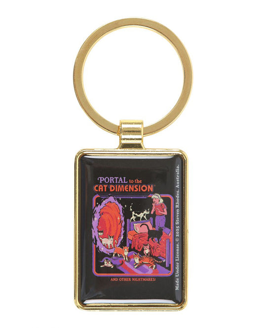 Steven Rhodes ‘Portal to the Cat Dimension’ keyring sold by Rebel Romance. This rectangular enamel accessory in a gold frame features a retro design with cats emerging from a portal into a bedroom. A quirky gift for cat fans, alternative style lovers, and collectors of gothic humour.