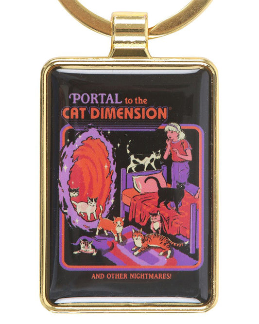 Retro enamel keyring from Rebel Romance featuring Steven Rhodes’ design ‘Portal to the Cat Dimension.’ A surreal bedroom scene shows cats pouring from a glowing red portal, with a girl looking shocked. Fun gothic gift for cat lovers and fans of quirky alternative accessories.