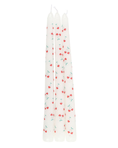  Full view of the Heart Cherry Taper Candles from Rebel Romance. The candles are neatly aligned, showing the consistent cherry heart print across all three. These charming candles add a sweet, retro touch to any home decor.