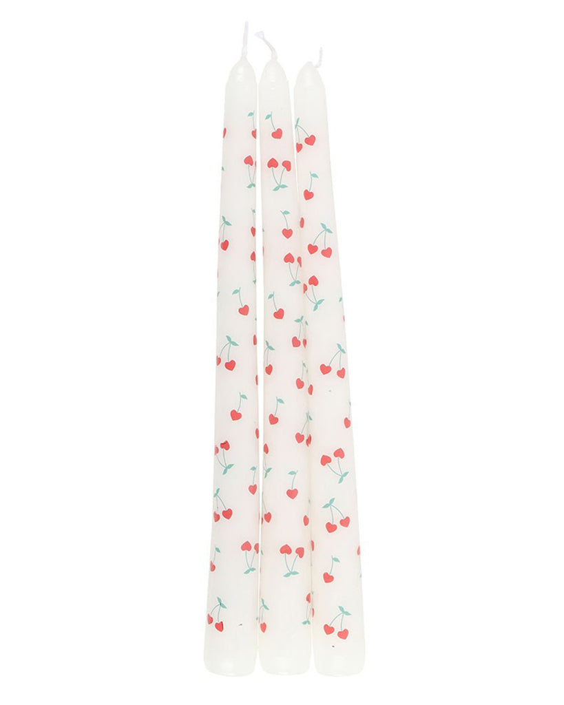  Full view of the Heart Cherry Taper Candles from Rebel Romance. The candles are neatly aligned, showing the consistent cherry heart print across all three. These charming candles add a sweet, retro touch to any home decor.