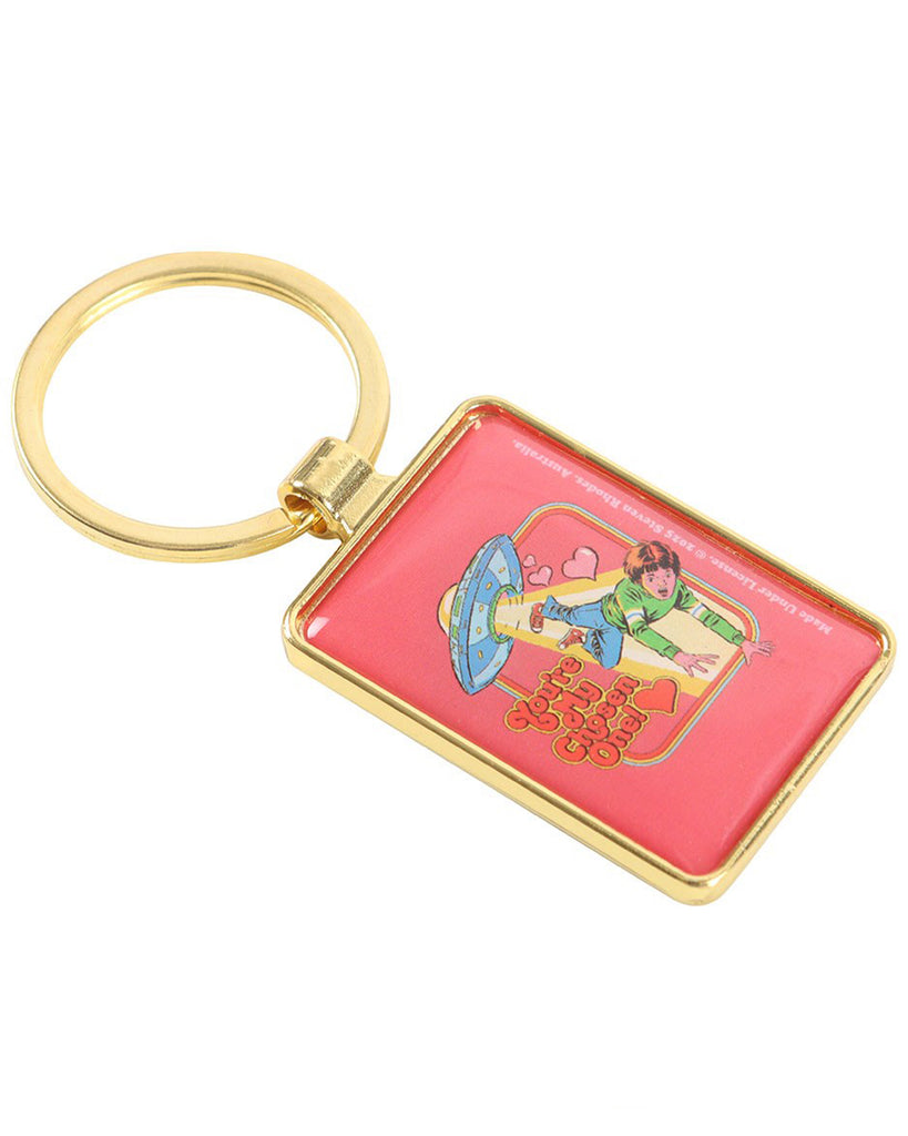Side view of the Rebel Romance Steven Rhodes “You’re My Chosen One!” keyring with a gold frame and split ring. Features a retro alien abduction illustration with UFO, hearts, and bold vintage typography. Perfect for adding kitsch alternative style to your everyday accessories.
