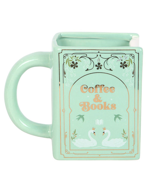 Front view of the Rebel Romance Coffee and Books green ceramic book-shaped mug. Decorated with swans, floral accents and the phrase Coffee & Books. A charming and unique mug for literature lovers who enjoy sipping coffee or tea while reading.