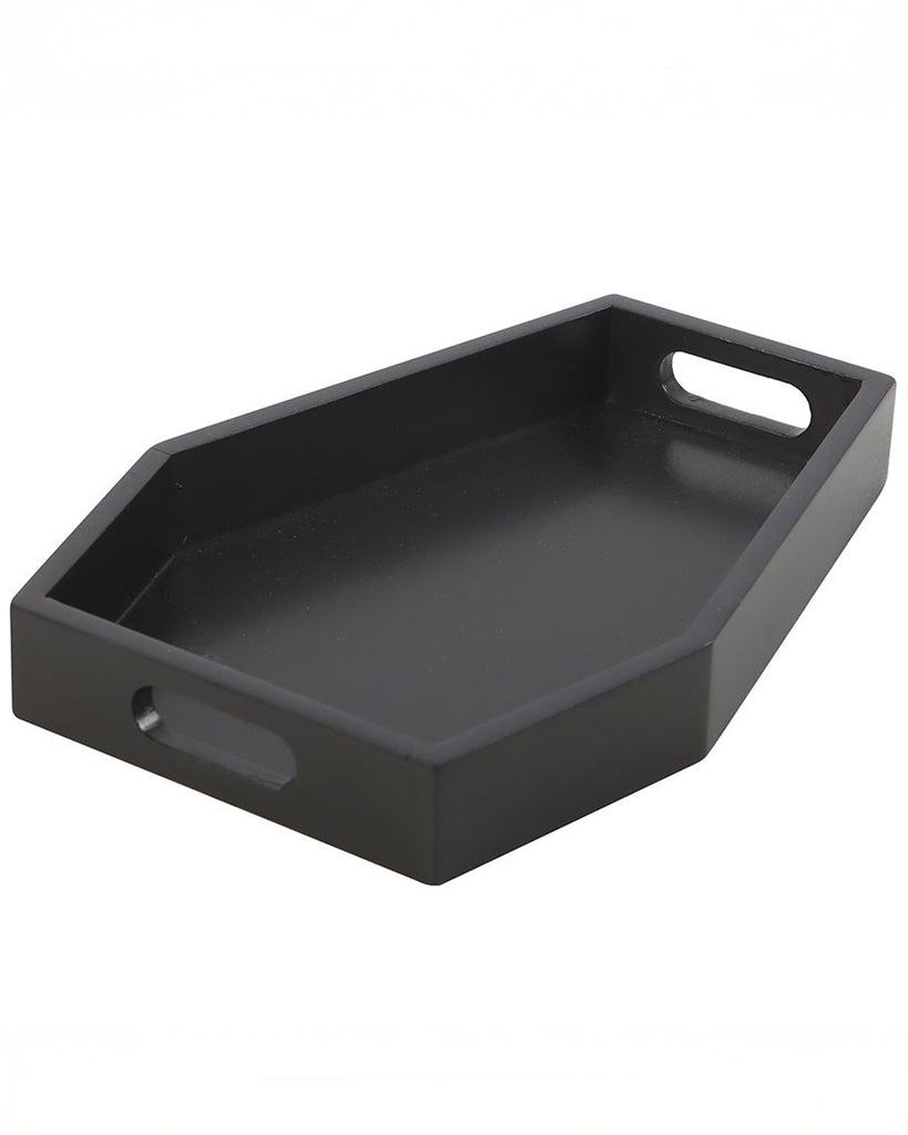 Angled view of a plain black coffin-shaped trinket tray made from MDF, with cut-out handles on each side. A gothic home accessory by Rebel Romance, perfect for displaying candles, jewellery, or small items.