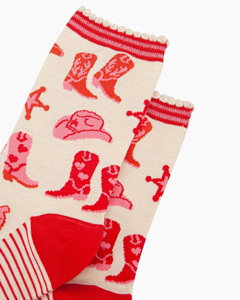 Close-up of the socks highlighting the bold cowgirl boot and western-themed design.