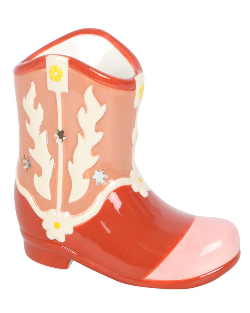  A ceramic pink and orange cowboy boot-shaped oil burner with floral patterns and glossy finish, featuring a hollowed-out design for wax melts or essential oils.