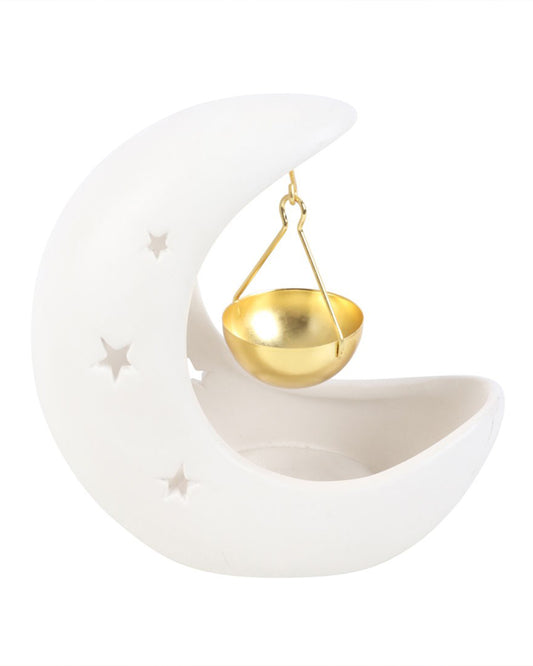 White crescent moon hanging oil burner by Rebel Romance, featuring a ceramic crescent design with star cut-outs and a gold hanging bowl for fragrance oils. A magical celestial homeware piece for alternative and mystical interiors.