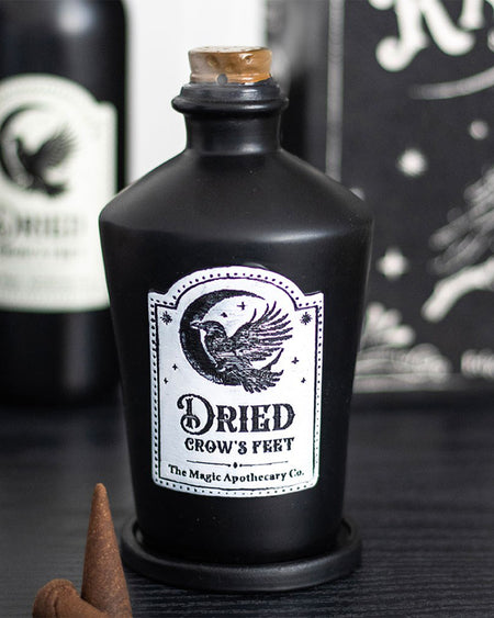 Stylised image of the Dried Crow’s Feet incense holder by Rebel Romance, showing label detail and cone placement— ideal gothic decor for millennials who love the mystical.