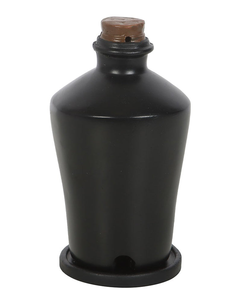 Close-up of the Dried Crow’s Feet incense cone holder by Rebel Romance, showing the matte black potion bottle shape with faux cork lid, perfect for alternative or gothic interiors.