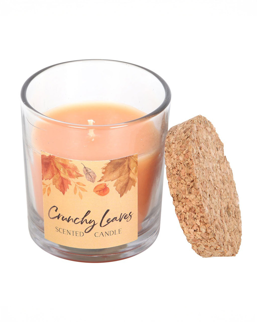 The Rebel Romance Crunchy Leaves candle in a clear glass jar with a natural cork lid. The label showcases a delicate autumn leaf design with warm orange tones. A must-have for autumn lovers looking for a seasonal home fragrance.