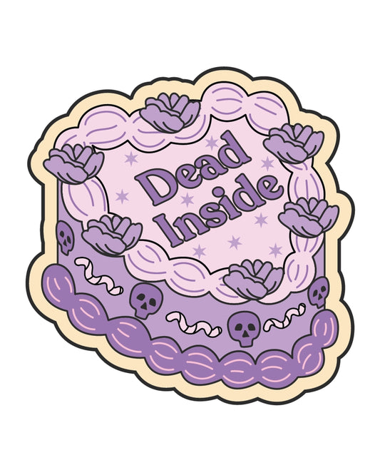 Illustrated heart-shaped vinyl sticker from Rebel Romance, designed by FUN CLUB. The design features a pastel purple and pink cake with flowers, skulls, worms, and the words “Dead Inside” in bold gothic-style lettering. A cute-meets-creepy aesthetic perfect for alternative fashion lovers and millennial goths. Made in the UK.