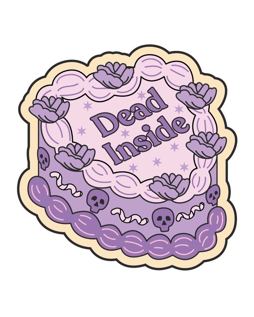 Illustrated heart-shaped vinyl sticker from Rebel Romance, designed by FUN CLUB. The design features a pastel purple and pink cake with flowers, skulls, worms, and the words “Dead Inside” in bold gothic-style lettering. A cute-meets-creepy aesthetic perfect for alternative fashion lovers and millennial goths. Made in the UK.