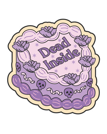 Illustrated heart-shaped vinyl sticker from Rebel Romance, designed by FUN CLUB. The design features a pastel purple and pink cake with flowers, skulls, worms, and the words “Dead Inside” in bold gothic-style lettering. A cute-meets-creepy aesthetic perfect for alternative fashion lovers and millennial goths. Made in the UK.