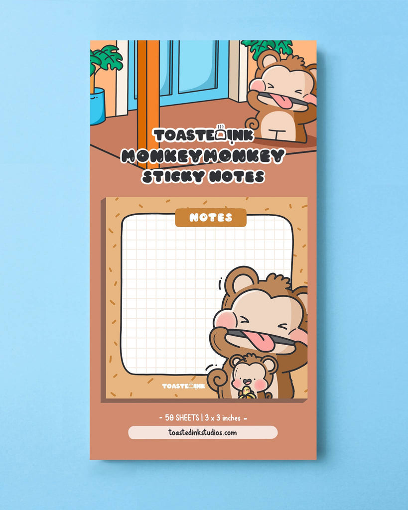 Cute Toastedink monkey sticky notes pad on a backing card with playful cartoon monkeys outside a house. Square notes with grid paper and “Notes” at the top, sold by Rebel Romance, a UK small biz celebrating alternative stationery and nostalgic designs for millennials.