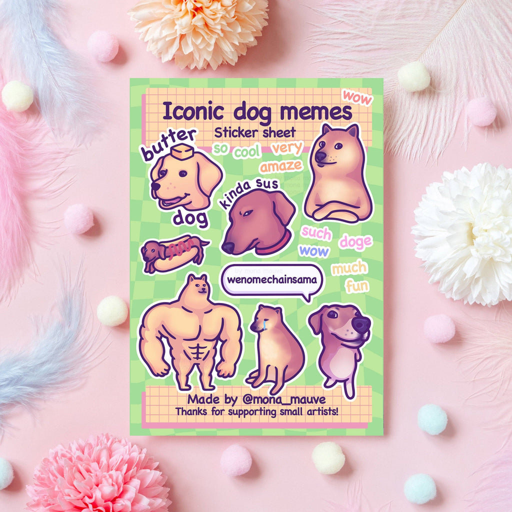 Flat lay of the Iconic Dog Memes Sticker Sheet by Mona Mauve featuring 18 waterproof vinyl stickers inspired by viral dog memes. Includes Doge, butter dog, muscle dog, “kinda sus,” “wenomechainsama,” and other internet-famous designs. Displayed on a soft pink background with pastel decorations. A perfect gift for meme fans and dog lovers.