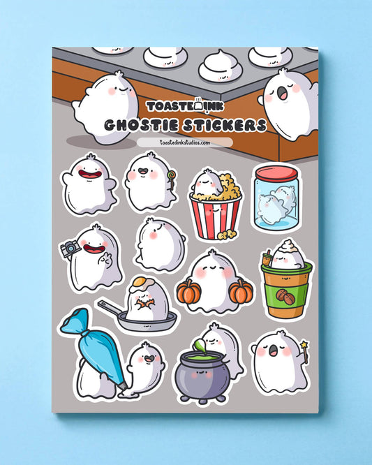 Full view of Toastedink’s ghostie sticker sheet on grey background. Includes kawaii ghost designs like ghosts in jars, sipping lattes, and popping out of cauldrons. Sold by Rebel Romance, an indie UK brand for alternative stationery and gifts.