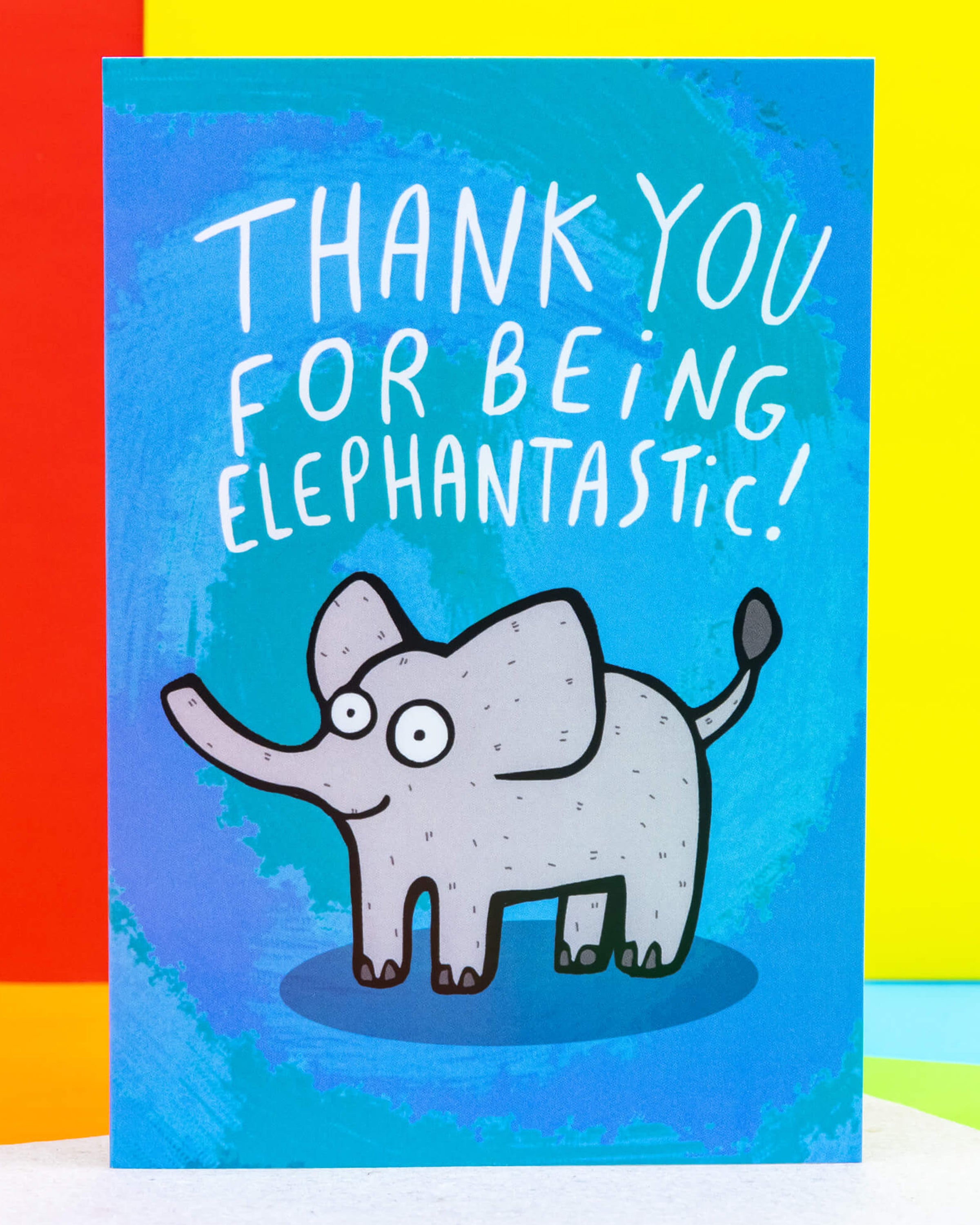 A colourful A6 greeting card by Rebel Romance featuring a cute cartoon elephant with wide eyes and the pun-filled message 