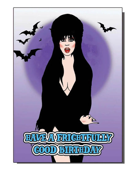 A spooky birthday card depicting a character inspired by Elvira with bats in the background and a glowing moon. The text reads “Have a frightfully good birthday” in bold, blue font
