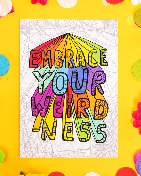 A bold and colourful A6 postcard with rainbow block letters reading “Embrace Your Weirdness” on a playful grey scribble background. Designed by Katie Abey, this bright and uplifting card is perfect for alternative millennials who love quirky stationery, self-expression, and dopamine decor with a message.