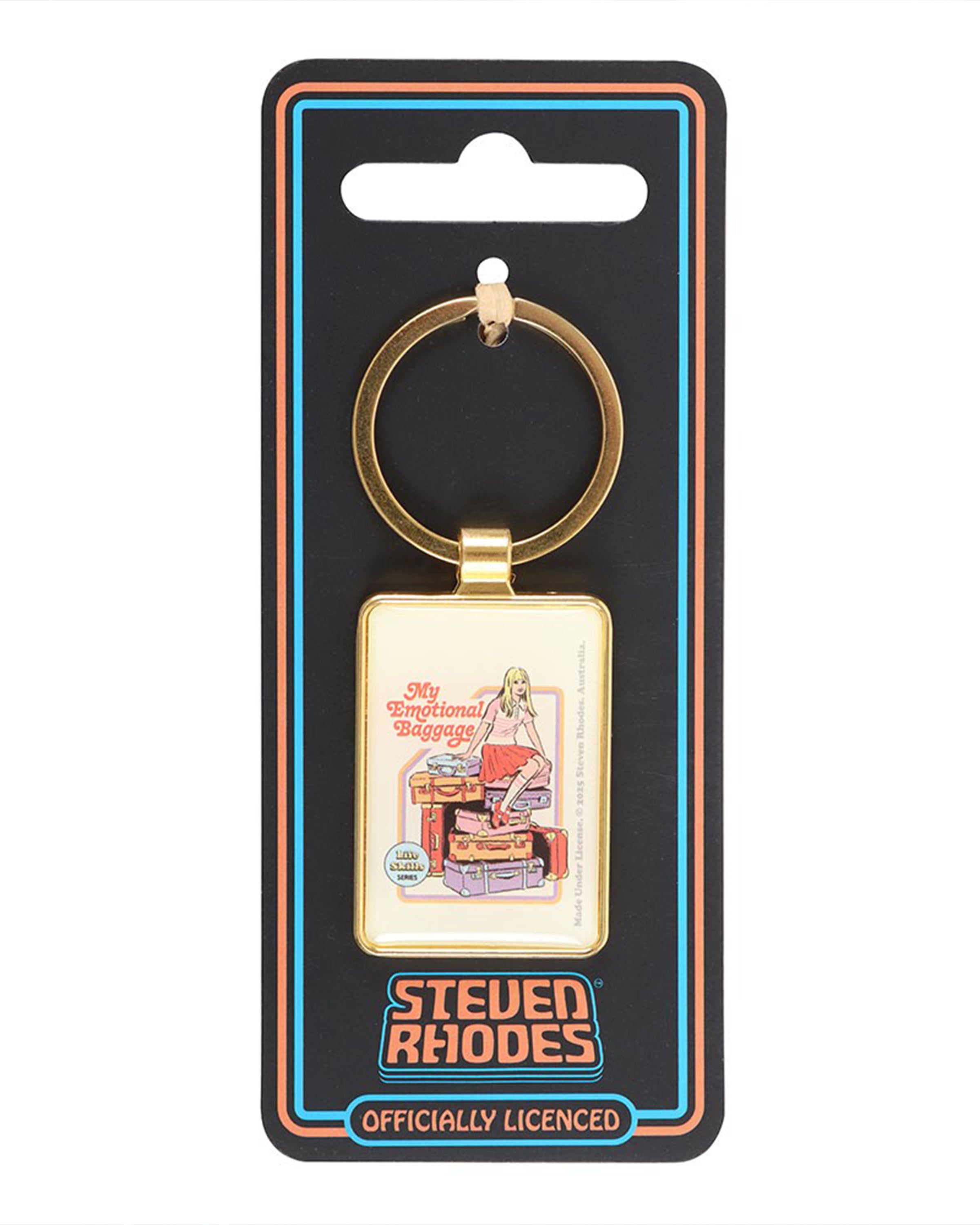 “My Emotional Baggage” enamel keyring by Steven Rhodes displayed on branded backing card from Rebel Romance. The rectangular gold keyring features a retro illustration of a girl sitting on stacked suitcases. A quirky alternative gift with vintage humour, perfect for millennials.
