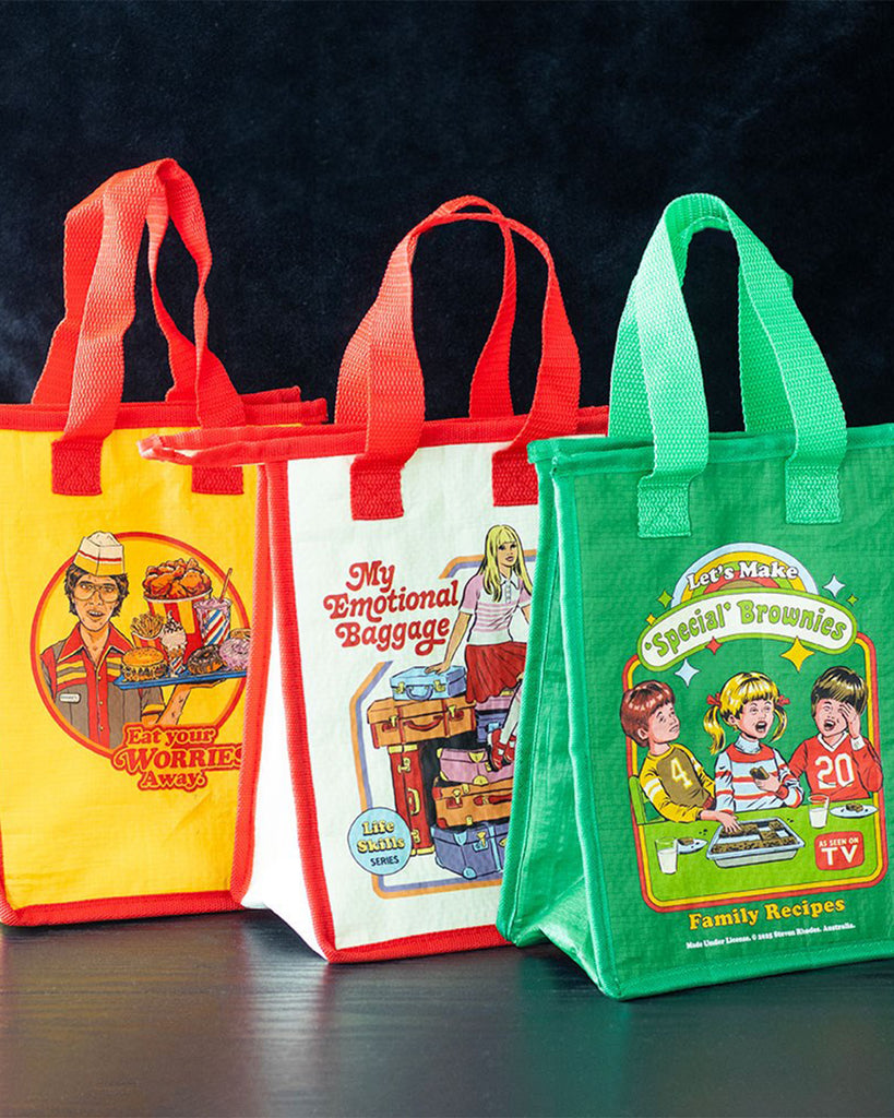 Three retro-style insulated lunch bags by Rebel Romance featuring Steven Rhodes artwork. Designs include "Eat Your Worries Away," "My Emotional Baggage," and "Let’s Make Special Brownies." Quirky, colourful, and eco-friendly, perfect for alternative fashion lovers and retro gift collectors.