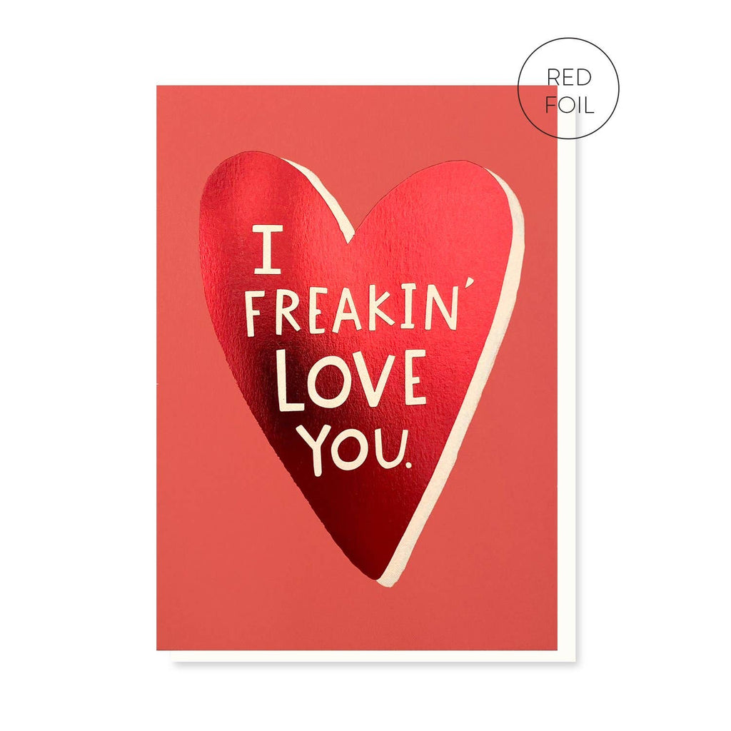 The “I Freakin’ Love You” card showcasing a bold red foil heart design on a coral background with white text. The minimalist and vibrant design is ideal for expressing affection.