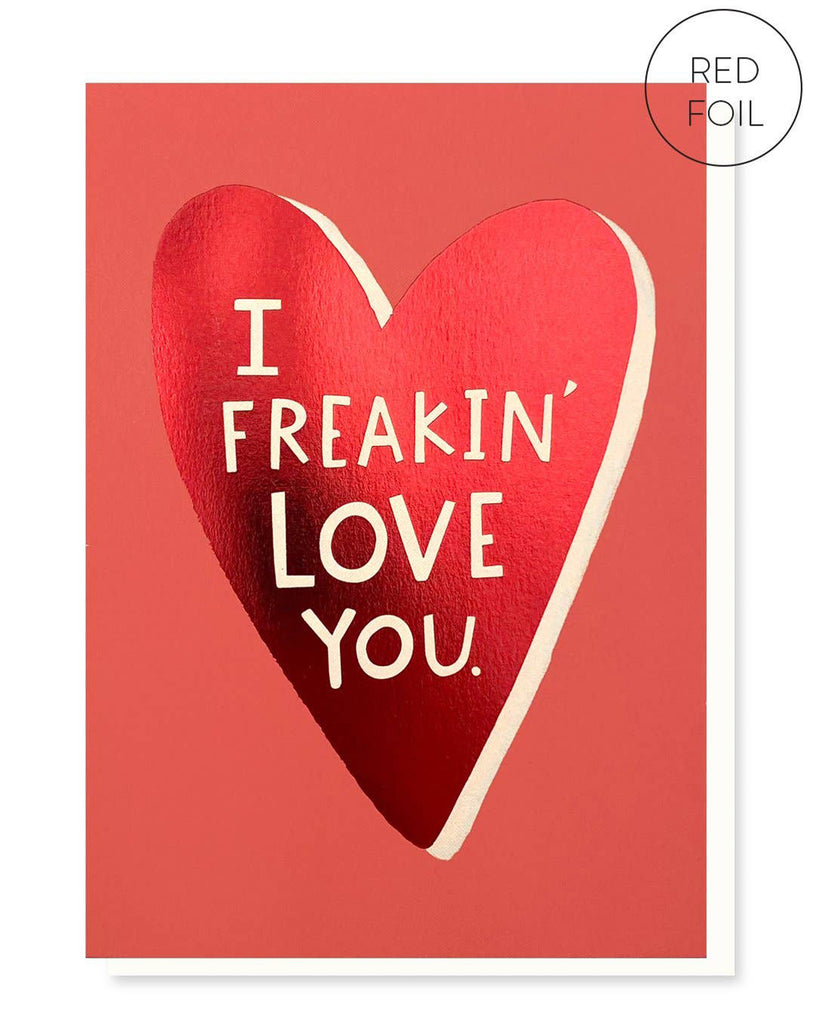 The “I Freakin’ Love You” card showcasing a bold red foil heart design on a coral background with white text. The minimalist and vibrant design is ideal for expressing affection.
