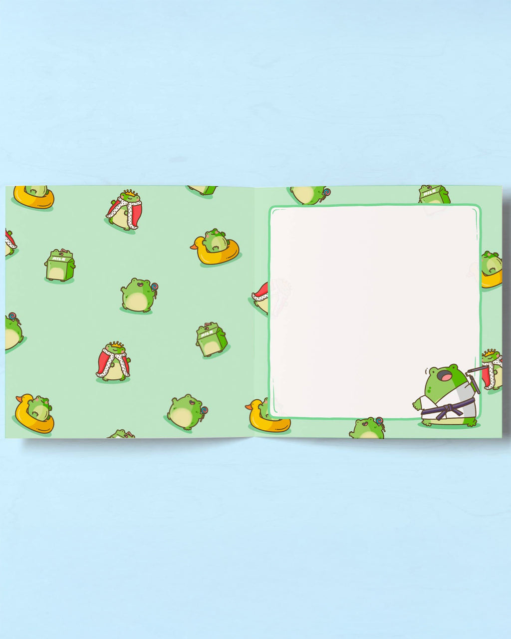 Interior of Toastedink’s frog-themed birthday card decorated with various cartoon frogs in funny costumes. One side has a blank square for writing. Sold by Rebel Romance, a UK-based small business celebrating quirky stationery.