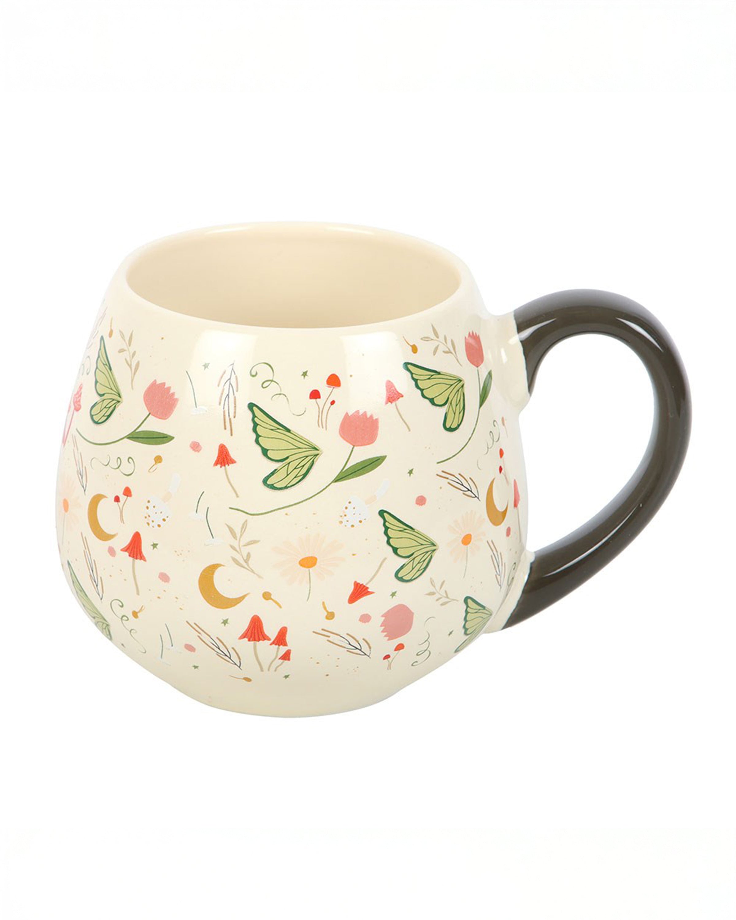 A rounded ceramic mug from Rebel Romance featuring a Fairy Folklore print with green butterflies, pink flowers, mushrooms and golden moons on a cream background. It has a smooth dark handle and is styled for cosy fairycore aesthetics, ideal for warm drinks and magical homeware lovers.