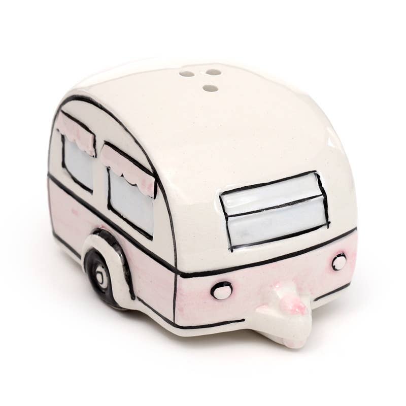 A ceramic salt or pepper shaker shaped like a vintage caravan in cream and pastel pink. Features illustrated windows with pink scalloped curtains. Part of the Home Is Where You Park It set from Rebel Romance, a UK brand for alternative home décor lovers.