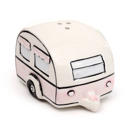 A ceramic salt or pepper shaker shaped like a vintage caravan in cream and pastel pink. Features illustrated windows with pink scalloped curtains. Part of the Home Is Where You Park It set from Rebel Romance, a UK brand for alternative home décor lovers.