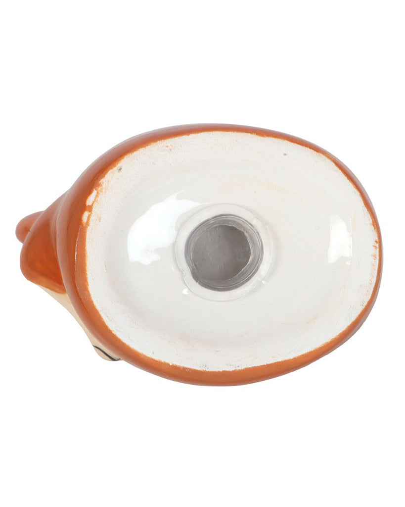 Underside of one of the fox salt and pepper shakers showing the refill hole and ceramic base.