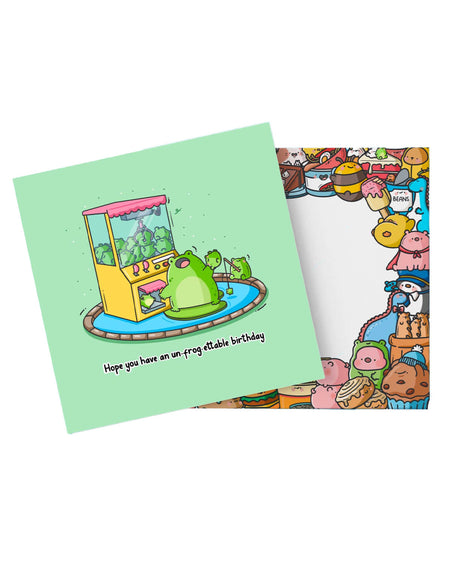 Toastedink’s un-frog-ettable birthday card and envelope featuring a frog-themed claw machine scene. Designed with adorable characters and bright colours. Available at Rebel Romance – the UK’s home for whimsical, alt greeting cards.