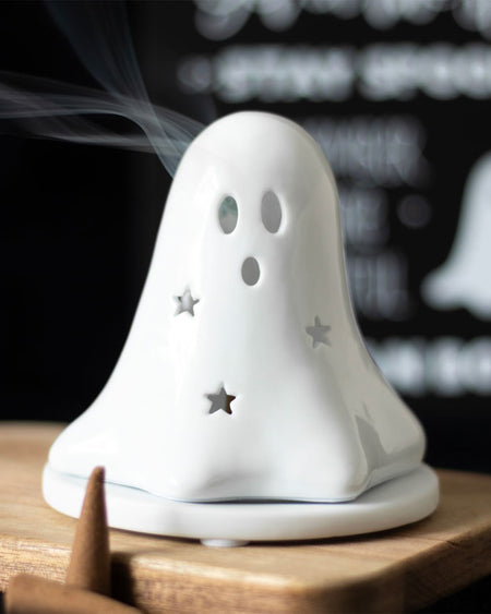 Smoke gently wafts from the eye sockets of a ghost-shaped ceramic incense holder by Rebel Romance UK. With cut-out stars and a glossy finish, it’s the ultimate Halloween home décor piece for fans of gothic, witchy, and alternative interiors.