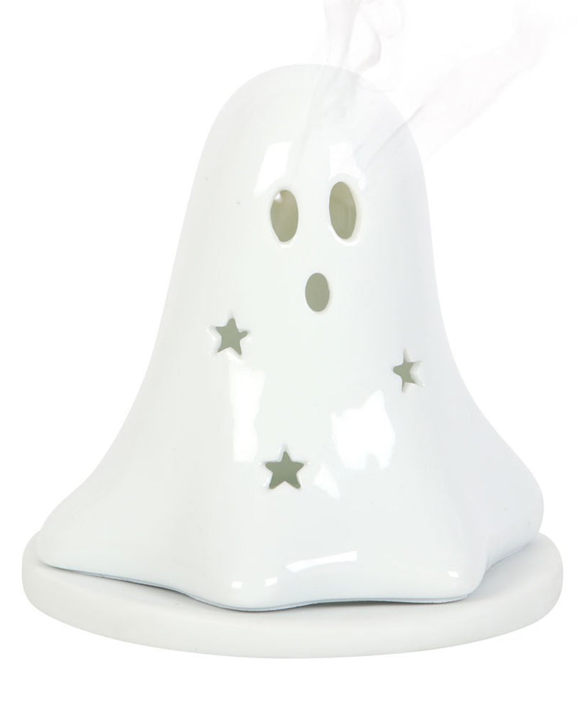 A ceramic ghost-shaped incense burner by Rebel Romance UK with star and face cut-outs. Delicate smoke is shown flowing from the eye holes, creating a magical effect that makes this an ideal gift for gothic home lovers and Halloween décor fans.