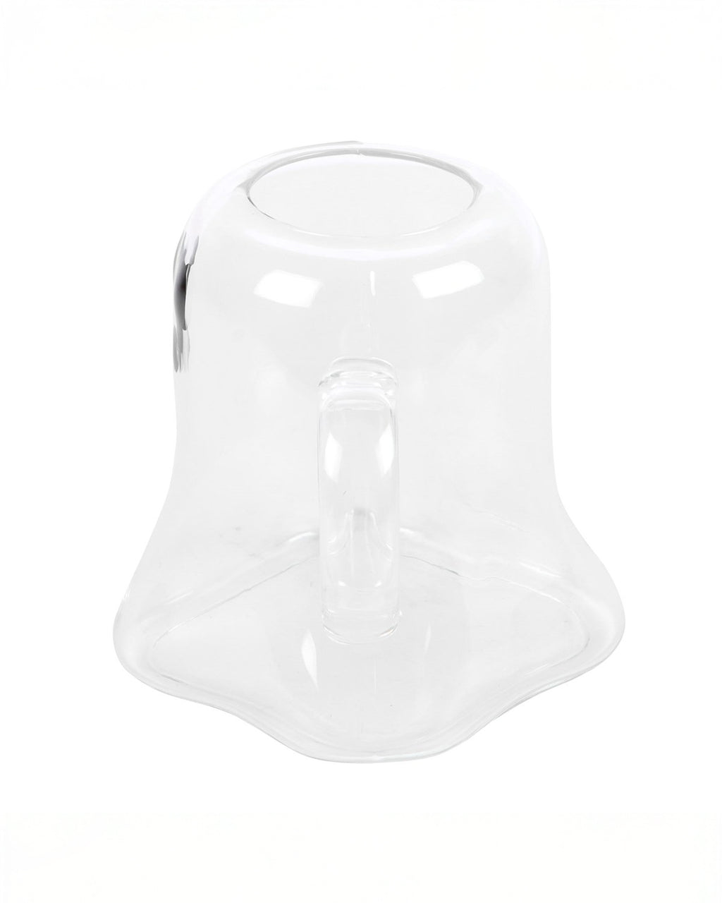 Side view of the Ghost Shaped Glass Mug from Rebel Romance, showing its wavy ghostly shape and a sturdy clear handle. The minimalistic yet spooky style makes it the perfect halloween gift.