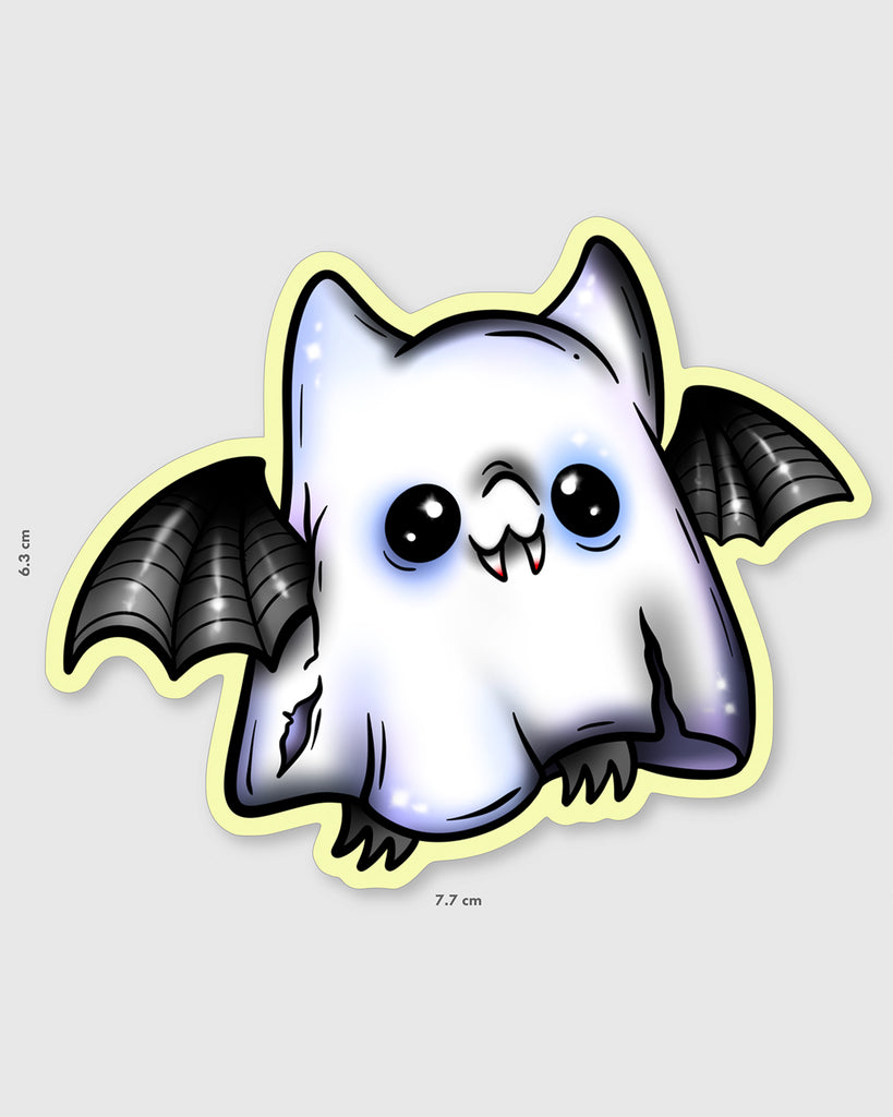 Glow in the dark ghost bat sticker featuring a cute cartoon bat dressed as a spooky ghost with torn edges and wide eyes. Black bat wings peek out from the ghost sheet design. Artwork by MilkTeef, perfect for Halloween lovers, spooky stationery collectors, and alternative style fans.