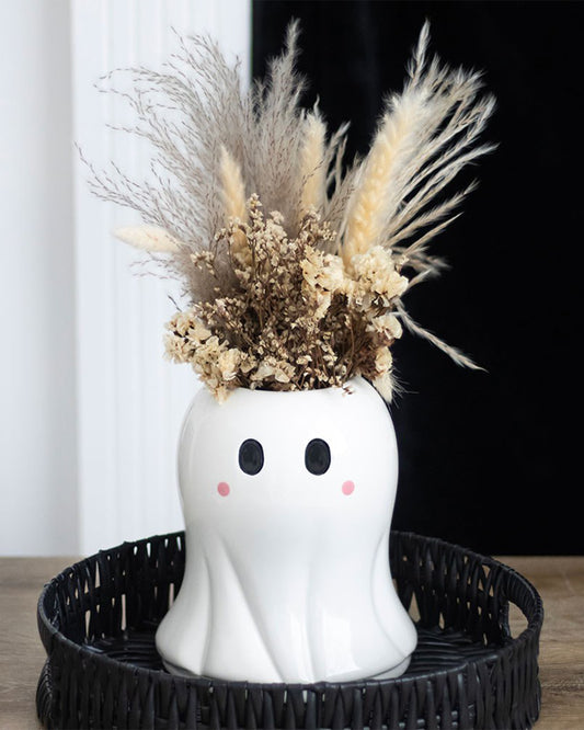 Rebel Romance Sweet Ghost Flower Vase styled in a black wicker tray and filled with pampas grass and dried flowers, making a charming centrepiece for autumn or gothic interiors.