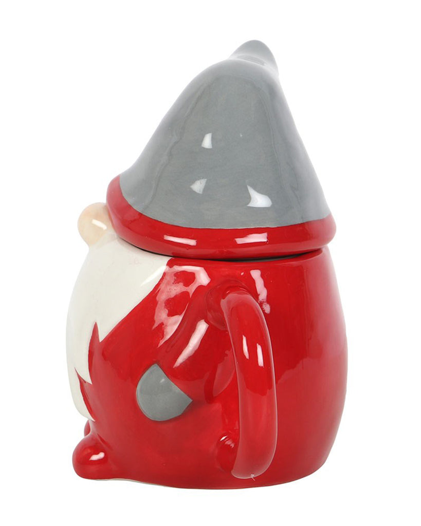 Side profile of the ceramic gonk mug showing the handle and hat lid detail from a different angle.