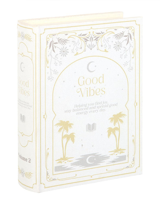 Angled view of Good Vibes book-shaped storage box by Rebel Romance. The faux book design includes Volume 2 on the spine, elegant gold accents, and celestial illustrations, perfect for stylish and secret storage.