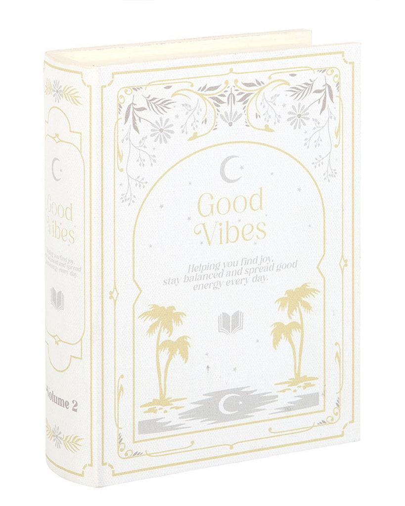 Angled view of Good Vibes book-shaped storage box by Rebel Romance. The faux book design includes Volume 2 on the spine, elegant gold accents, and celestial illustrations, perfect for stylish and secret storage.