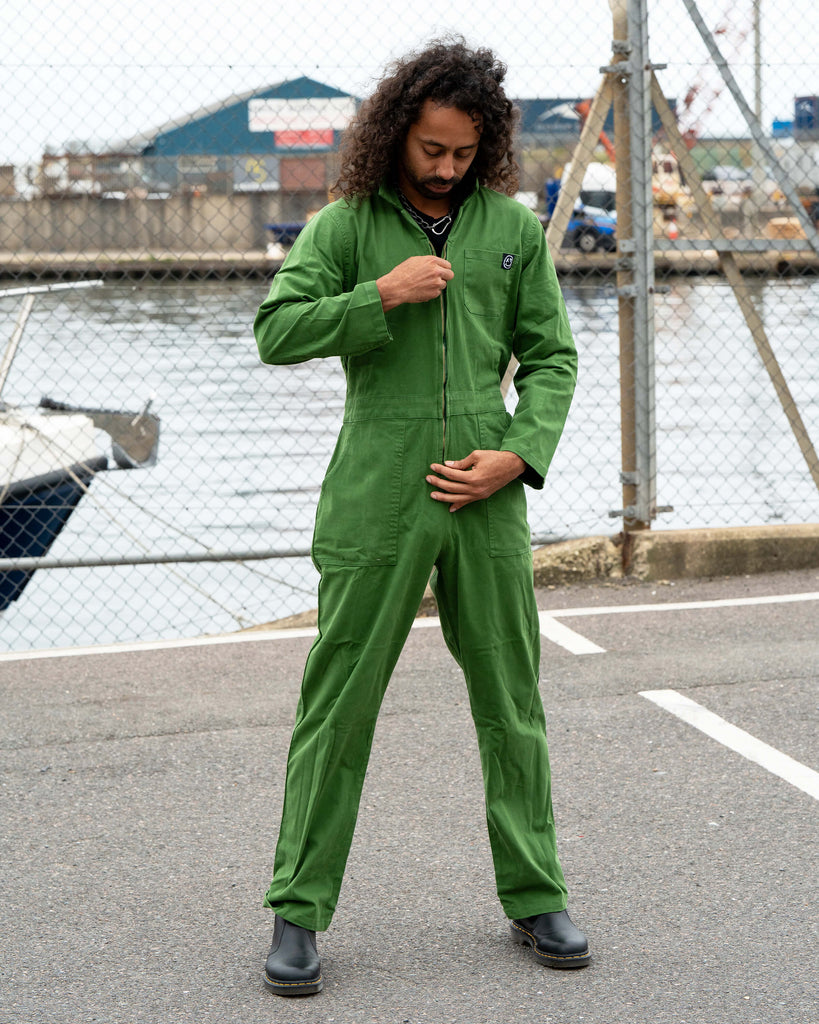 Richard posing in the Forest Green Boiler Suit with an expressive stance, showing movement and confidence in the relaxed fit.