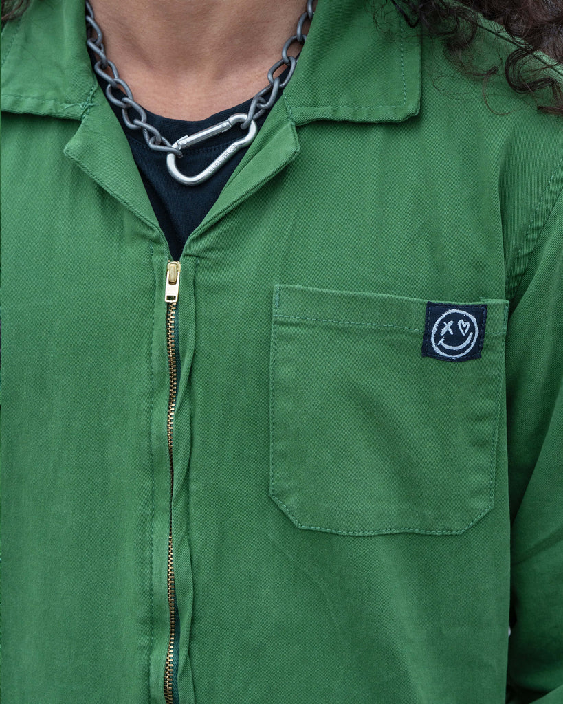 Richard posing in the Forest Green Boiler Suit with an expressive stance, showing movement and confidence in the relaxed fit.