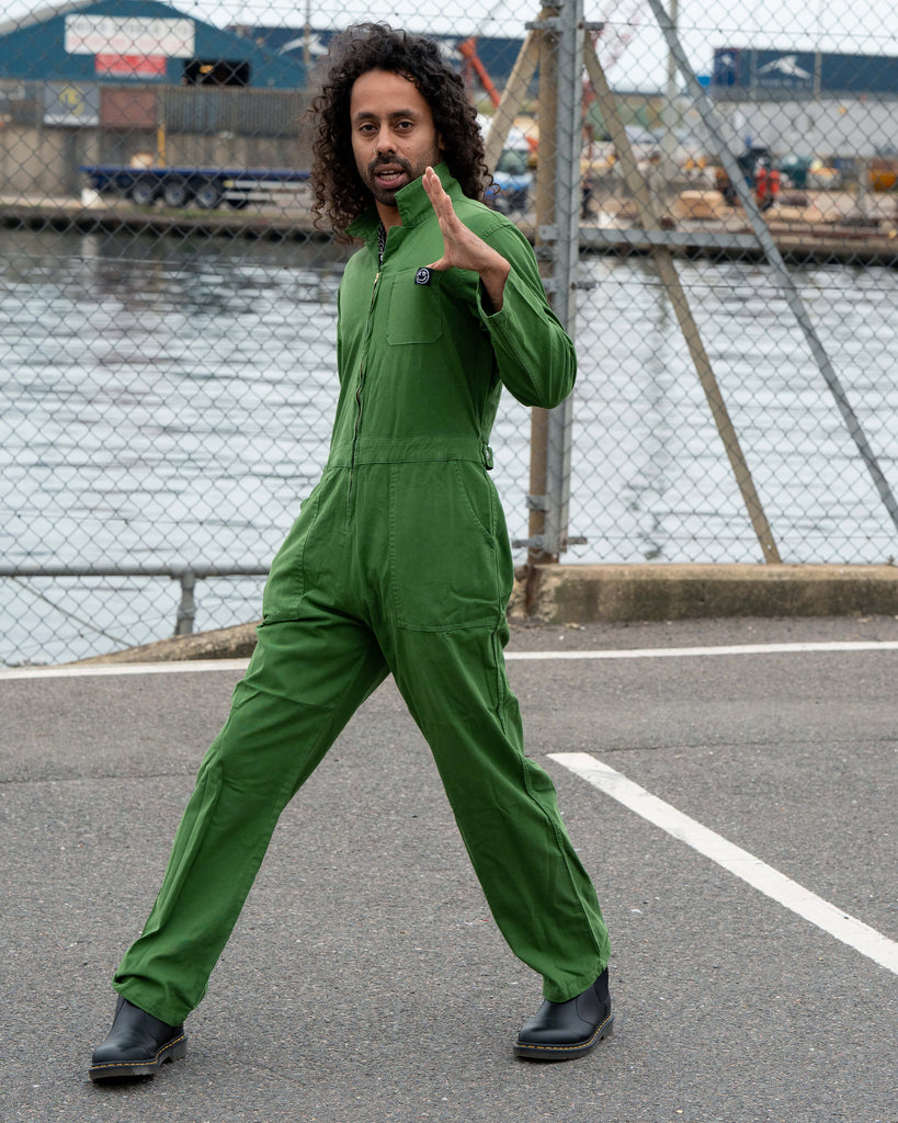 Richard posing in the Forest Green Boiler Suit with an expressive stance, showing movement and confidence in the relaxed fit.