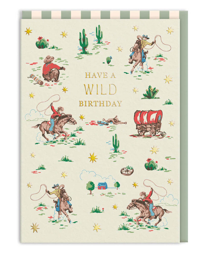 Cowboy-themed birthday card designed by Cath Kidston, featuring vintage-style Wild West scenes with cowboys, horses, cacti, and a covered wagon. Gold foil text reads “Have a Wild Birthday.” Stocked by Rebel Romance, this nostalgic A6 greeting card comes with a matching striped envelope, perfect for adventurous birthday celebrations with a retro twist.