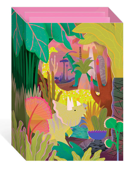 3D pop up greeting card from Rebel Romance featuring colourful prehistoric herbivorous dinosaurs in a vibrant jungle scene. Designed by Natasha Durley, this neon laser-cut card includes a triceratops and other plant-eating dinos surrounded by lush plants and retro-inspired tropical vibes. A quirky, fun card perfect for dinosaur lovers and alternative stationery collectors.