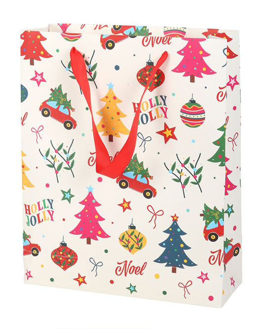 A 23cm Rebel Romance Nostalgic Christmas Print Gift Bag with red ribbon handles. The festive design features colourful Christmas trees, baubles, stars, cars carrying trees, and the words “Holly Jolly” and “Noel”, perfect for alternative Christmas gifting.