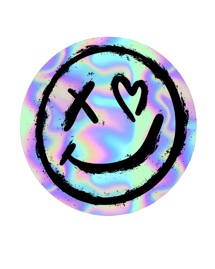 Original Rebel Romance logo holographic vinyl sticker, featuring a grunge-inspired smiley face with an X-eye and heart-eye design. Colourful, reflective finish perfect for customising laptops, phones, and accessories.