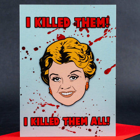 Funny greeting card featuring Angela Lansbury’s illustration with splattered blood effect and bold text saying ‘I KILLED THEM! I KILLED THEM ALL!’ on a light blue background.