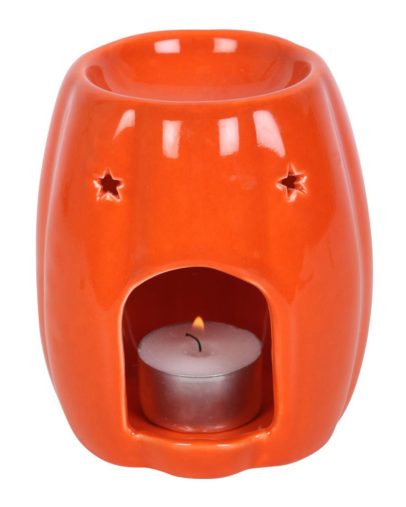 Bright orange ceramic oil burner by Rebel Romance shaped like a pumpkin, with a smooth, glossy finish. A bold Halloween home accessory ideal for wax melts or essential oils.